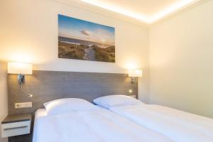 Ένα ή περισσότερα κρεβάτια σε δωμάτιο στο Hotel Mukran
