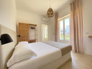Postel nebo postele na pokoji v ubytování Maison Sciscì