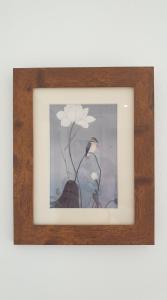 a framed picture of a bird and a flower at Argyll House Bed and Breakfast in Westleton