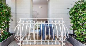 a porch with a white rack with towels on it at Anastasi Residence in Cervia