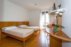 Postel nebo postele na pokoji v ubytování Hotel Tre Re