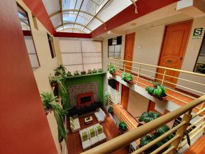 an overhead view of a building with plants and a staircase at El Mariscal Cusco in Cusco