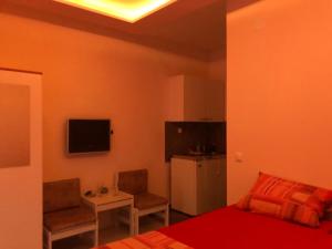 Televízia a/alebo spoločenská miestnosť v ubytovaní Guesthouse Adriatic