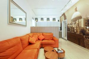 a living room filled with furniture and a couch at Ta Gianni Guest House in Sliema