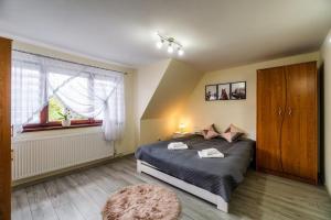 Posteľ alebo postele v izbe v ubytovaní Apartament Polany