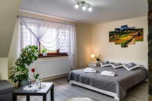 Posteľ alebo postele v izbe v ubytovaní Apartament Polany