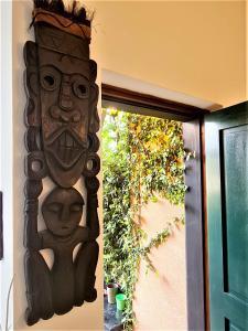 a wooden wall decoration on a wall next to a door at Lovely House in Santa Margherita Ligure