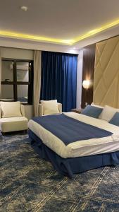 Ein Bett oder Betten in einem Zimmer der Unterkunft فندق ايديا