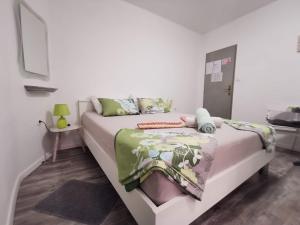 a bedroom with a large white bed with at The Palace Mattiazzi Room in Šibenik