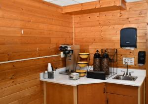 a kitchen with a coffee maker on a counter at Stillwater Inn & Suites in Stillwater