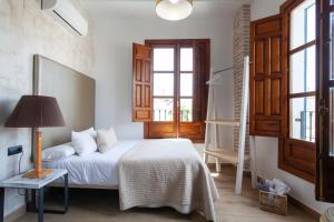 Postel nebo postele na pokoji v ubytování Sueño de Elvira + 37 fotografií