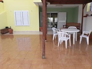 a dining room with a table and chairs in a room at FRAMANTIS App No 6 in Costa Calma +9 photos