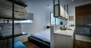 Postel nebo postele na pokoji v ubytování Hanasi 129 - Boutique Apartments