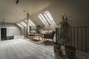 a living room with a couch and a table at Guest House Garoza with Self Check-in in Tūja