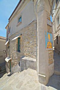 a building with a painting on the side of it at Il Fascino del Borgo in Castellabate