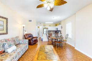 a living room with a couch and a table at Tropic Isl 501 in Gulf Shores