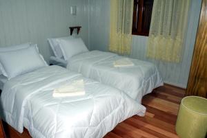 Ένα ή περισσότερα κρεβάτια σε δωμάτιο στο Pousada Bauernhof