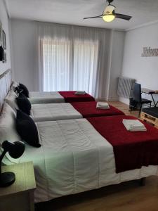 Postel nebo postele na pokoji v ubytování Pensión Muro de la Mata