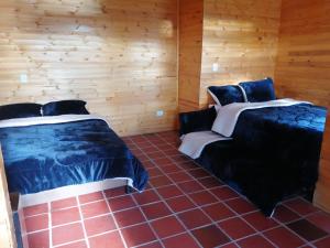 Postel nebo postele na pokoji v ubytování Guatavita Campestre Suites