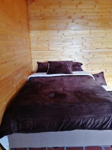 Postel nebo postele na pokoji v ubytování Guatavita Campestre Suites