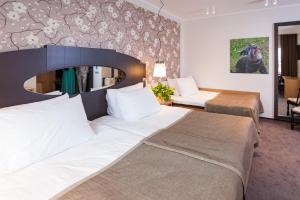 Postel nebo postele na pokoji v ubytování Paide SPA Hotell + 19 fotografií