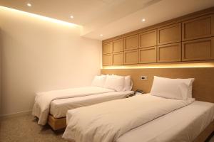 Tempat tidur dalam kamar di Hotel Vantt