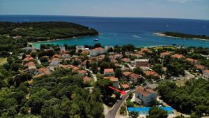 an aerial view of a town with a red arrow at Apartman Milan in Banjole