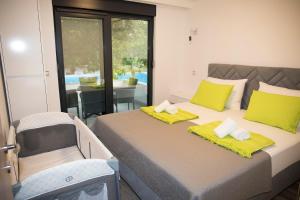 Postel nebo postele na pokoji v ubytování Luxury Villa Magic