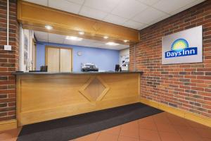 a view of a days inn reception desk in a building at Days Inn by Wyndham Sevenoaks Clacket Lane in Westerham