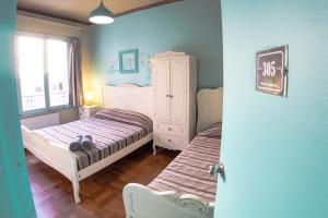 Cama ou camas em um quarto em Hostal Providencia