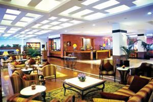 a lobby with couches and tables in a hotel at Radisson Hotel Kathmandu in Kathmandu
