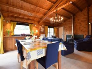 a dining room with a table and chairs at Cosy chalet in Durbuy in a beautiful hiking area in Durbuy