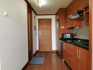 Una cocina o kitchenette en Hermoso Depto, 1Linea Roca Mar Sector Costa Brava