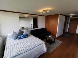 Una cama o camas en una habitación de Hermoso Depto, 1Linea Roca Mar Sector Costa Brava