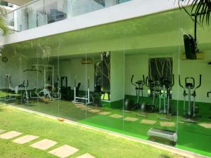 a glass walled gym with exercise equipment in a building at Morros Vitri memorable in Cartagena de Indias
