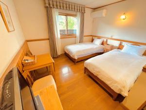 Een bed of bedden in een kamer bij Nikko Akarinoyado Villa Revage