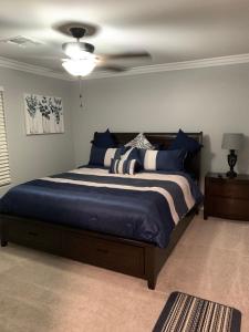 a bedroom with a bed and a ceiling fan at New Bullheadcity Pool Home Great Rates 5 Star in Bullhead City