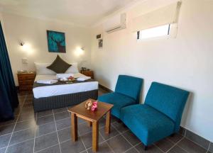Postel nebo postele na pokoji v ubytování Darwin Resort