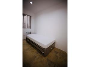 Posteľ alebo postele v izbe v ubytovaní OYO 789 Abn Residences