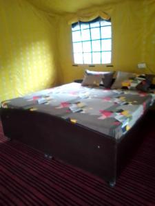 Posteľ alebo postele v izbe v ubytovaní Nayar Valley Retreat