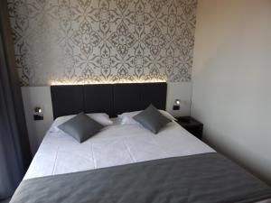 Posteľ alebo postele v izbe v ubytovaní Ilga Hotel