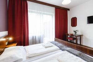 Postelja oz. postelje v sobi nastanitve Hotel Hoffinger