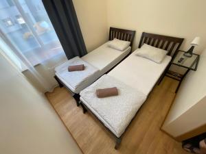 Postel nebo postele na pokoji v ubytování ApartHotel Riga