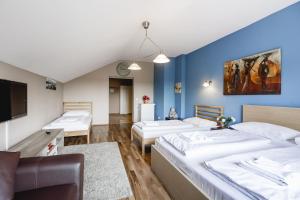 Säng eller sängar i ett rum på Hotel Hoffinger
