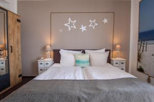 Letto o letti in una camera di AKZENT Strandhotels Seestern, Delphin & Lachs