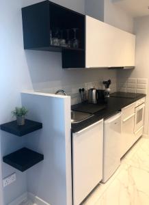 a kitchen with a white stove top oven at Angel Suites in Nicosia