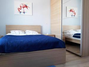 Posteľ alebo postele v izbe v ubytovaní Apartament Imagus Oliwa