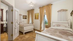 Postel nebo postele na pokoji v ubytování Apartments Villa BV