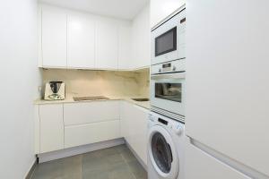 Køkken eller tekøkken på Elviria Playa White Pearl Beach