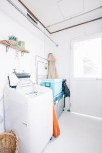 a laundry room with a washer and dryer at House number 7106 - Vacation STAY 10493 in Furugen